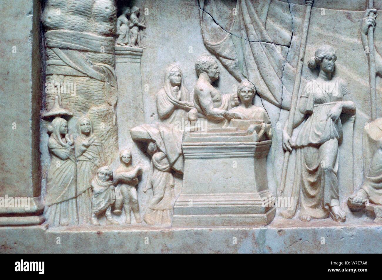 Greek relief of a family sacrificing. Artist: Unknown Stock Photo