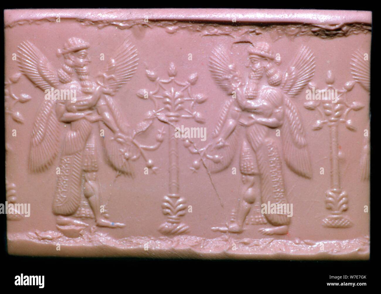 Neo-Assyrian cylinder-seal impression showing mythical beings making offerings. Artist: Unknown Stock Photo