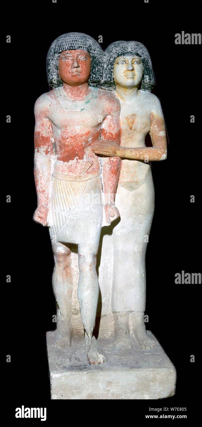 Egyptian sculpture of a man and his wife. Artist: Unknown Stock Photo ...
