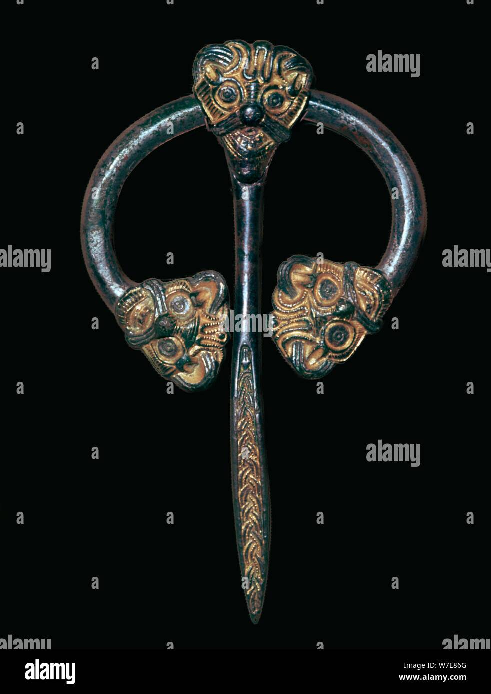 Viking gilded bronze dress fastener, 9th century. Artist Unknown Stock