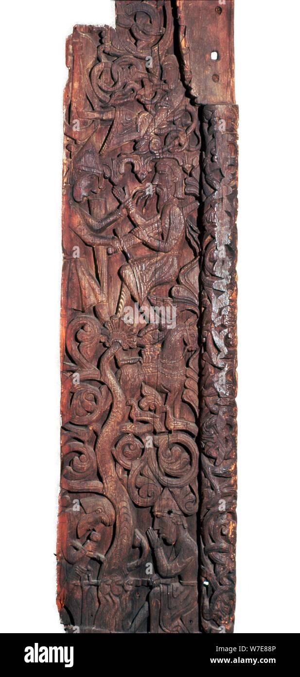 Wooden portal of Hylestad church, showing Sigurd roasting the dragon's heart. Artist: Unknown Stock Photo
