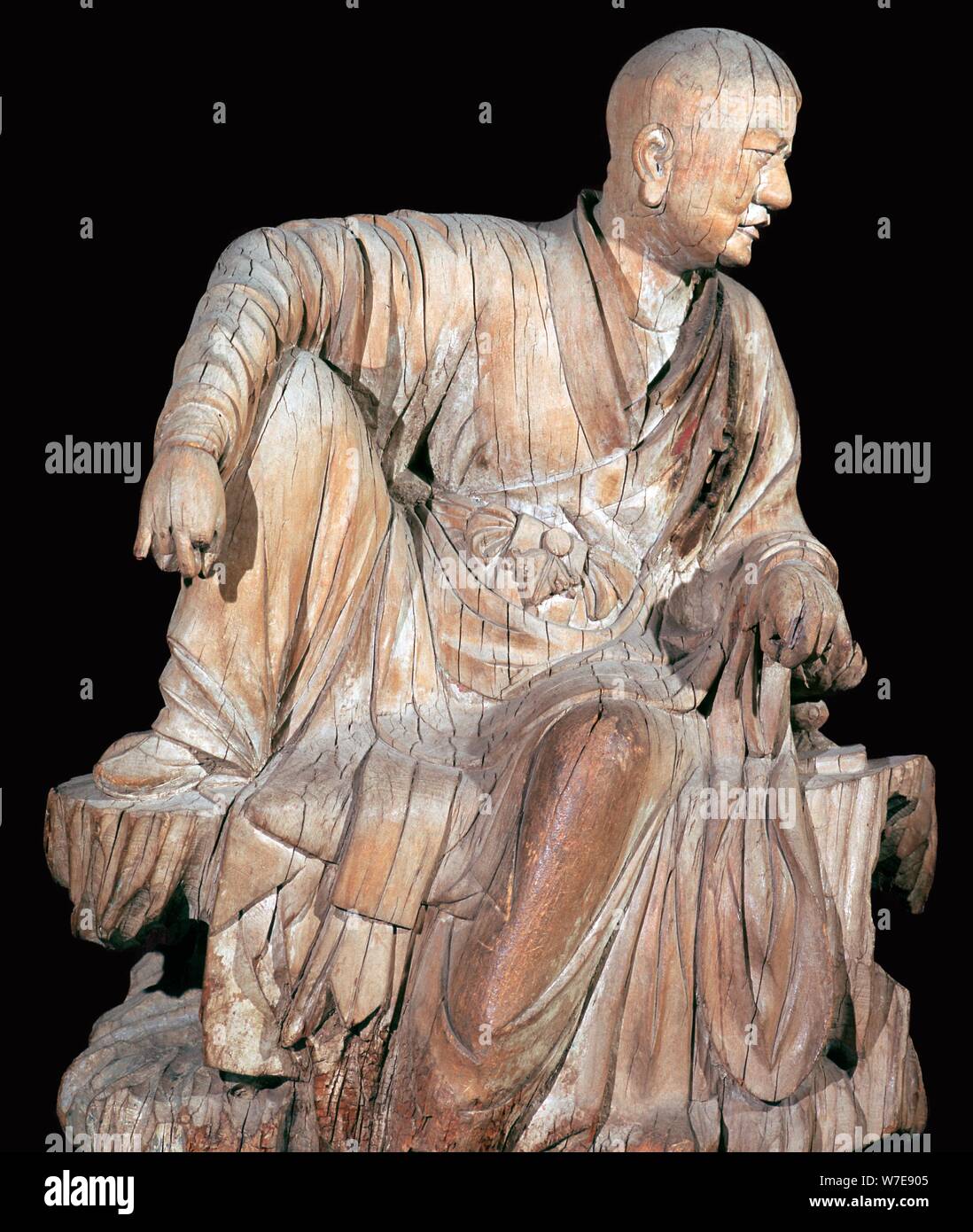 Statuette of a disciple of the Buddha, 14th century. Artist: Unknown Stock Photo