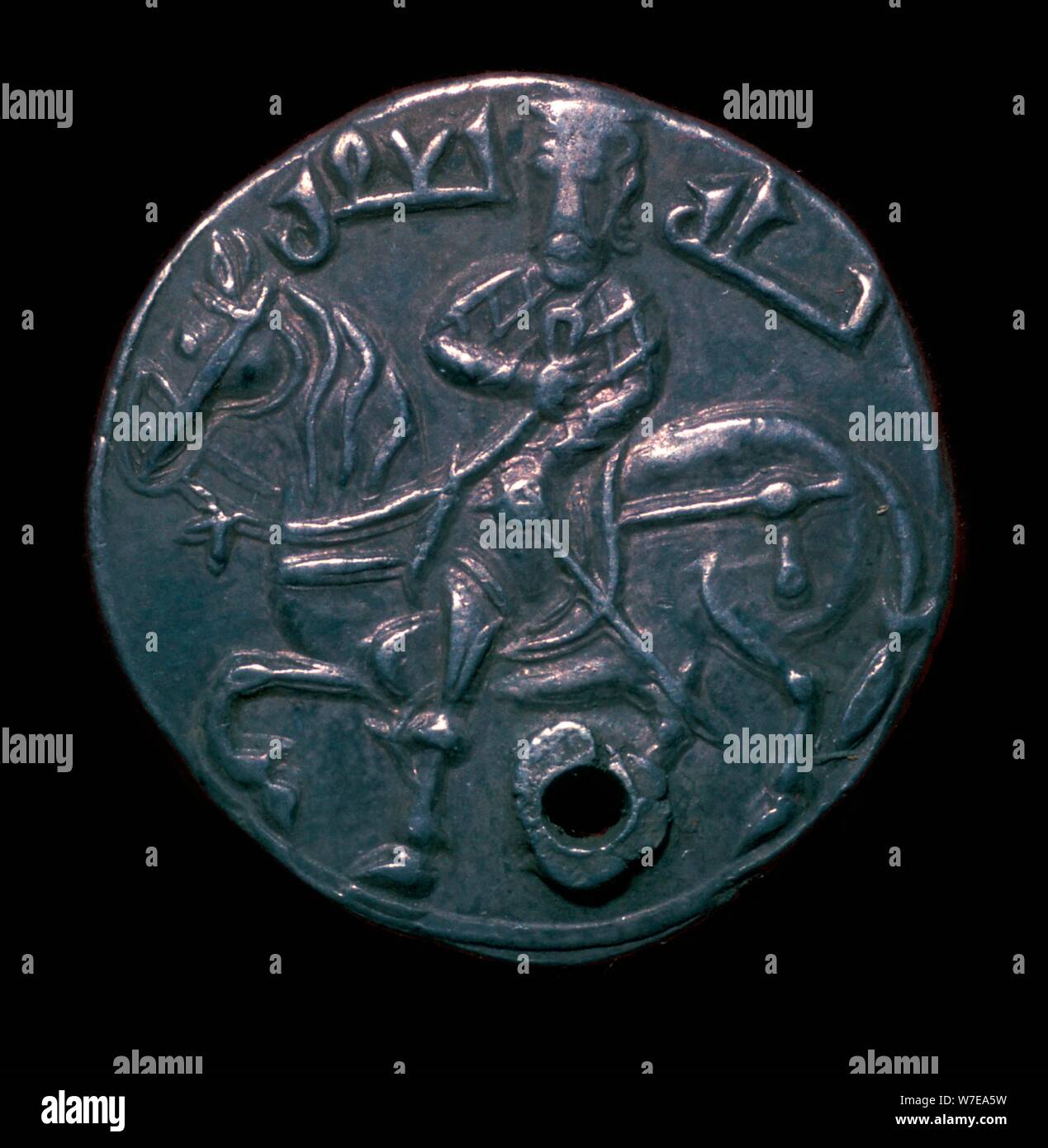 Silver dirham with a horse and rider, 10th century. Artist: Unknown Stock Photo