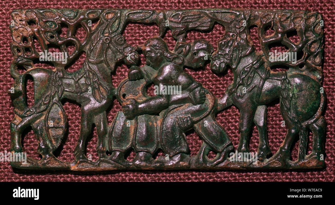 Chinese bronze harness-plaque of wrestling men, 5th century BC. Artist: Unknown Stock Photo
