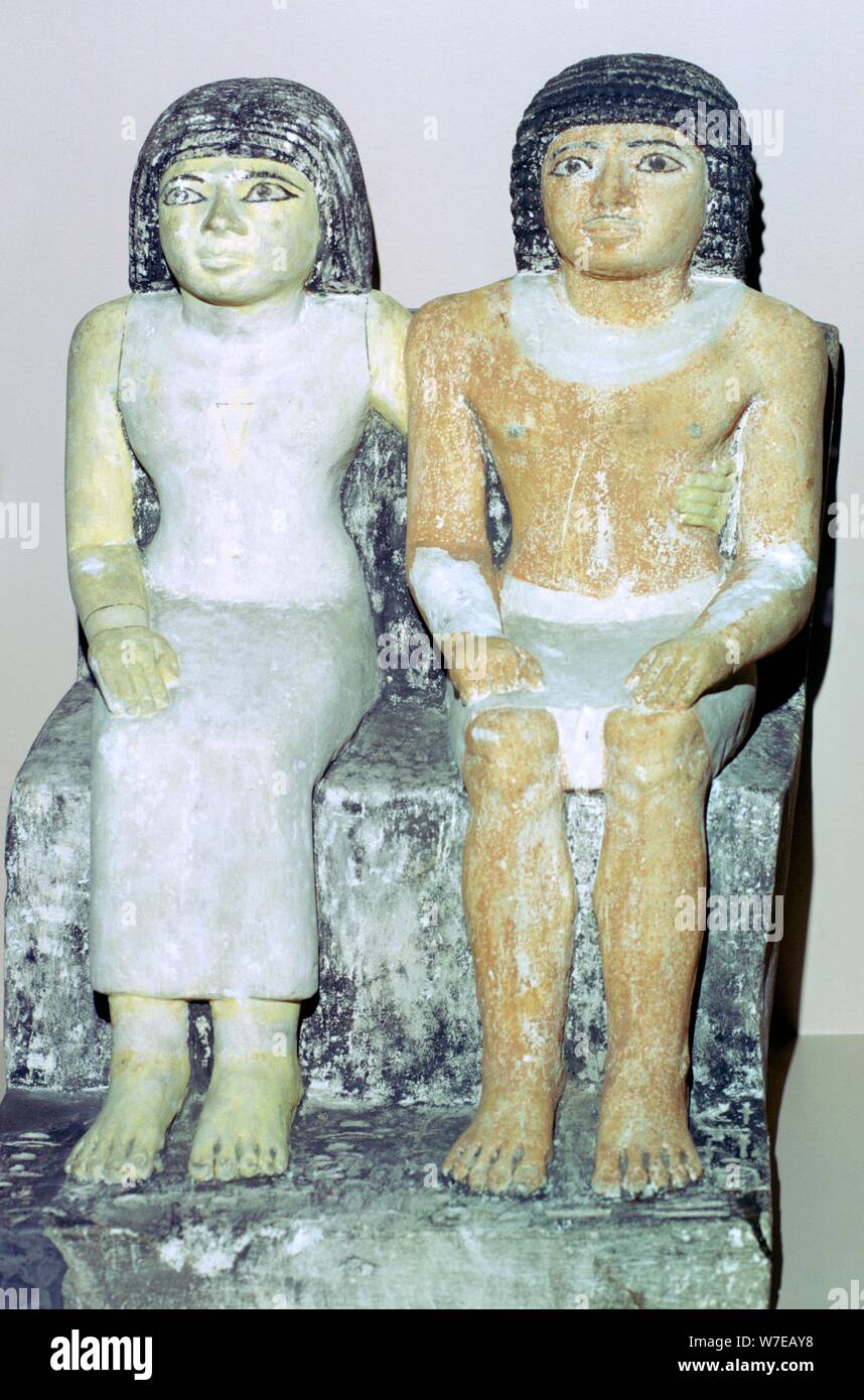 Limestone Egyptian statue of a man and his wife. Artist: Unknown Stock ...