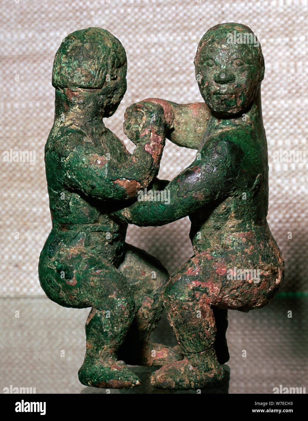 Bronze figures of two wrestlers, Eastern Zhou Dynasty, China, c5th-4th Century BC. Artist: Unknown Stock Photo