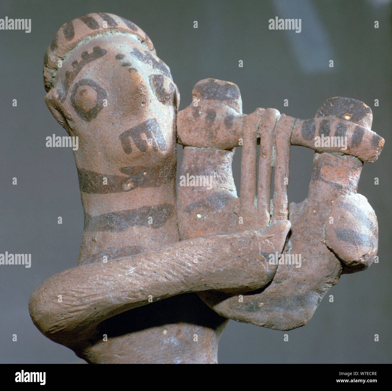 Minoan terracotta figure of a lyre-player, 8th century BC. Artist: Unknown Stock Photo