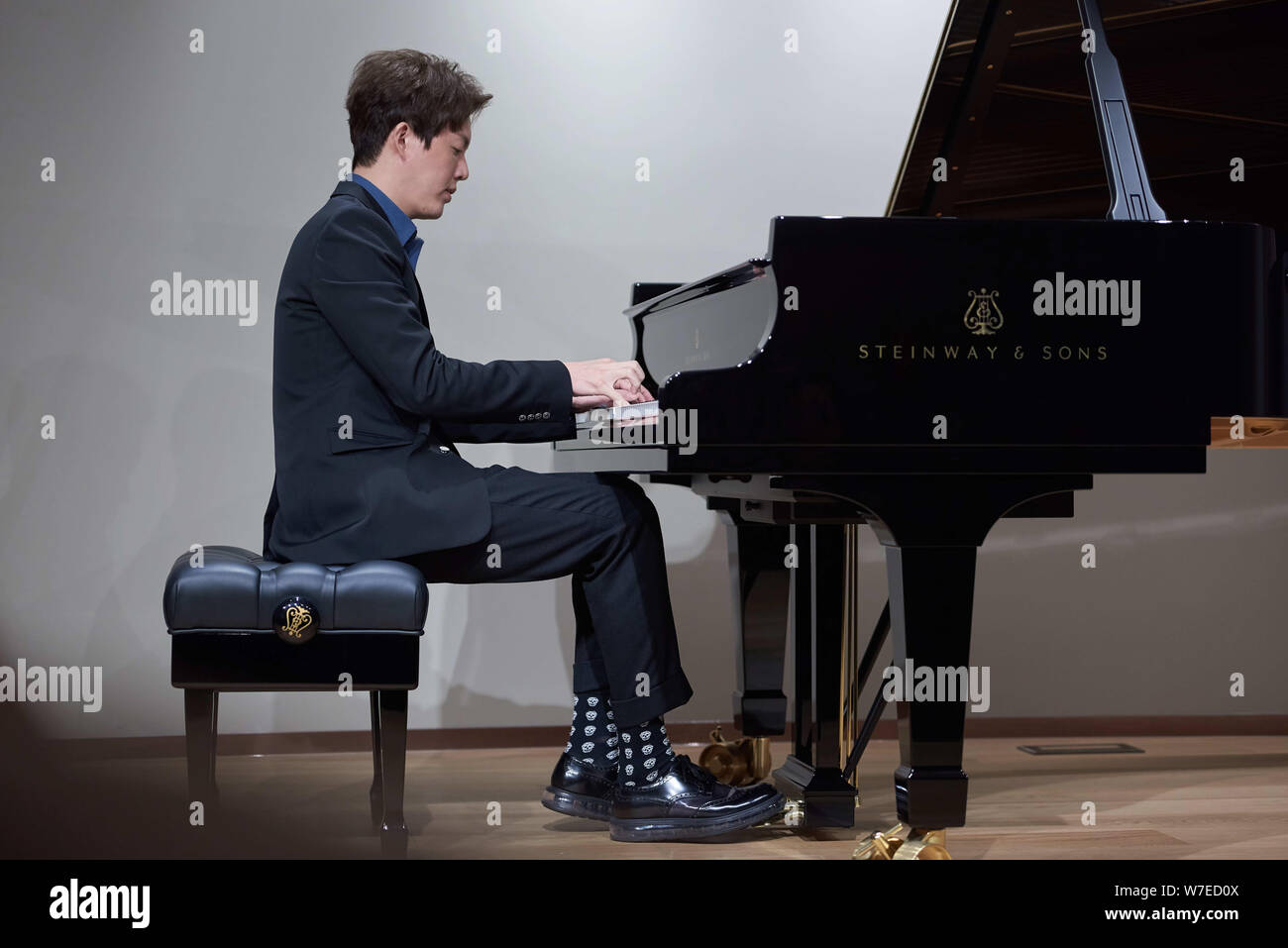 Chinese pianist Li Yundi shows his piano skills during his master class
