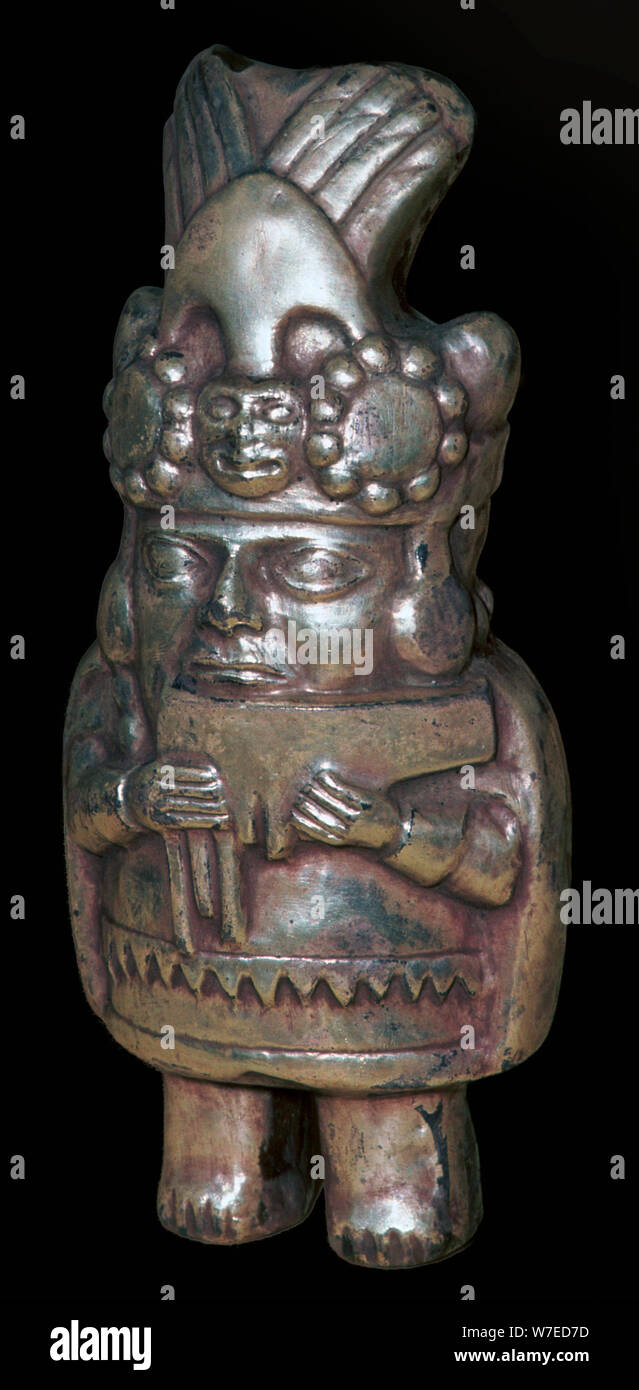 Incan silver figure of a man with panpipes. Artist Unknown Stock