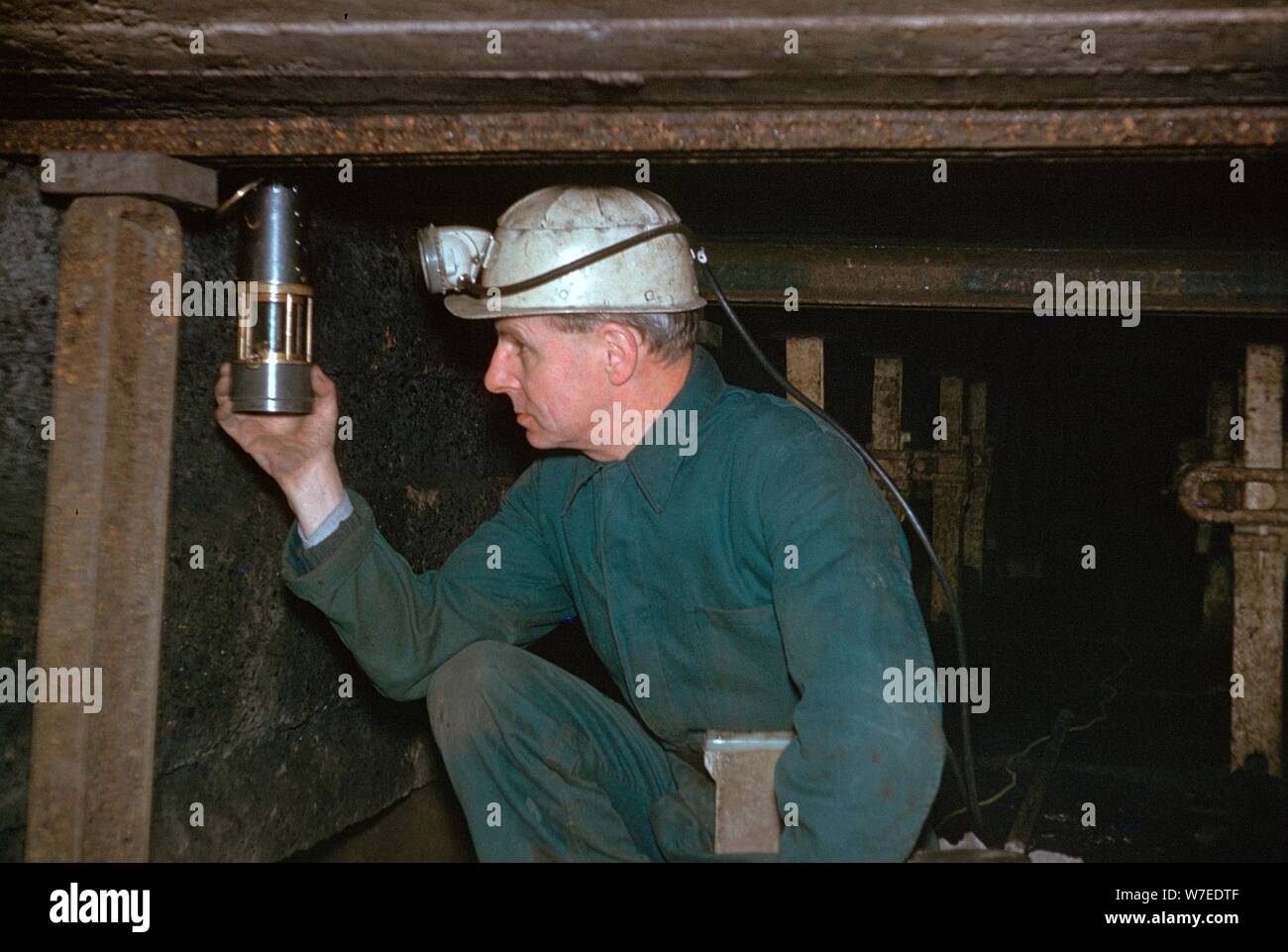 Pity Deputy tests for gas using Davy Safety Lamp. Stock Photo