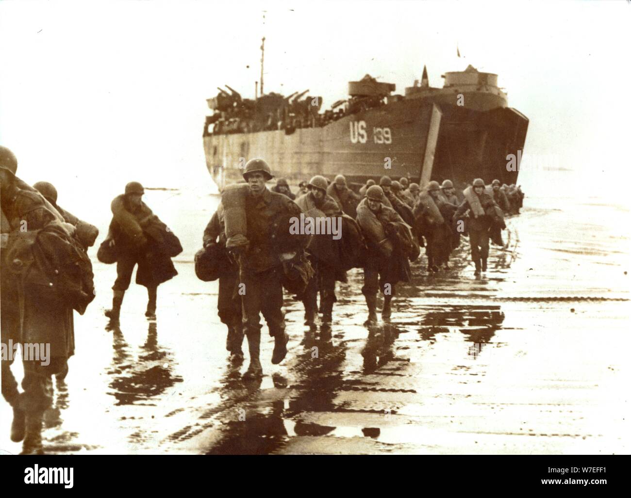 American troops disembark onto the sands of Normandy, 1944. Artist: Unknown Stock Photo