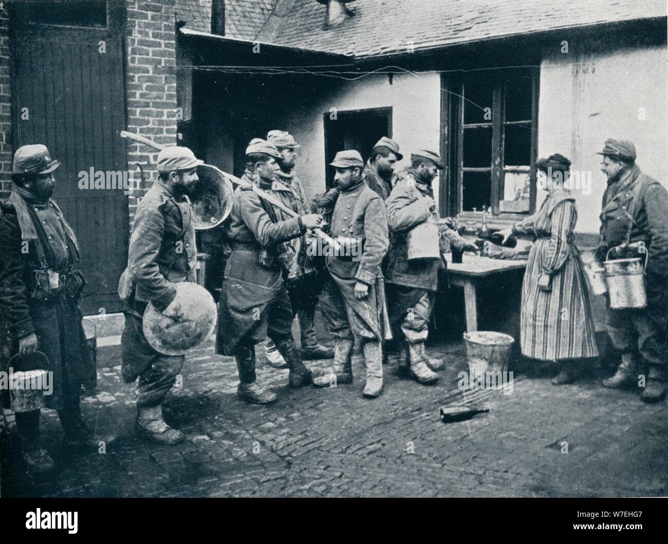 French soldiers returning from the trenches make a halt for refreshment, c1914. Artist: Unknown Stock Photo