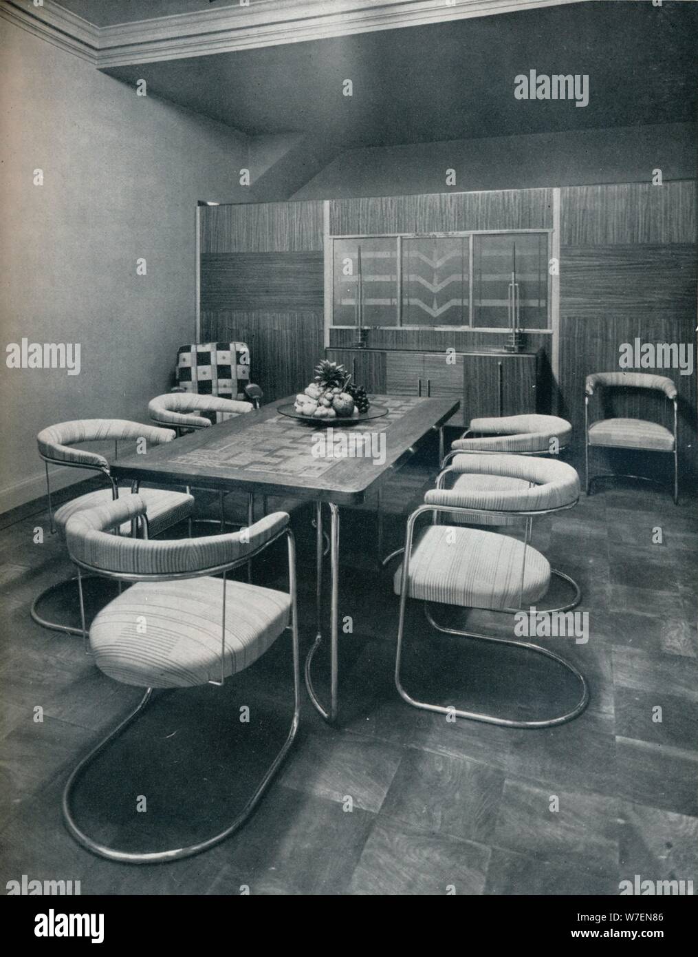 A Dining Room Suite With Table And Chairs Of Steel Tube By