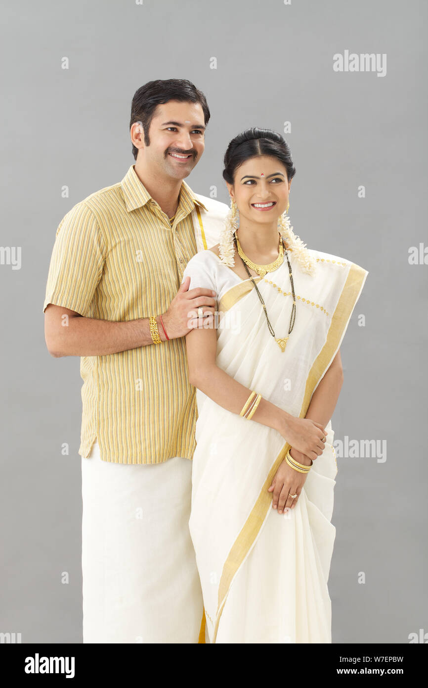 South Indian couple standing together smiling Stock Photo - Alamy