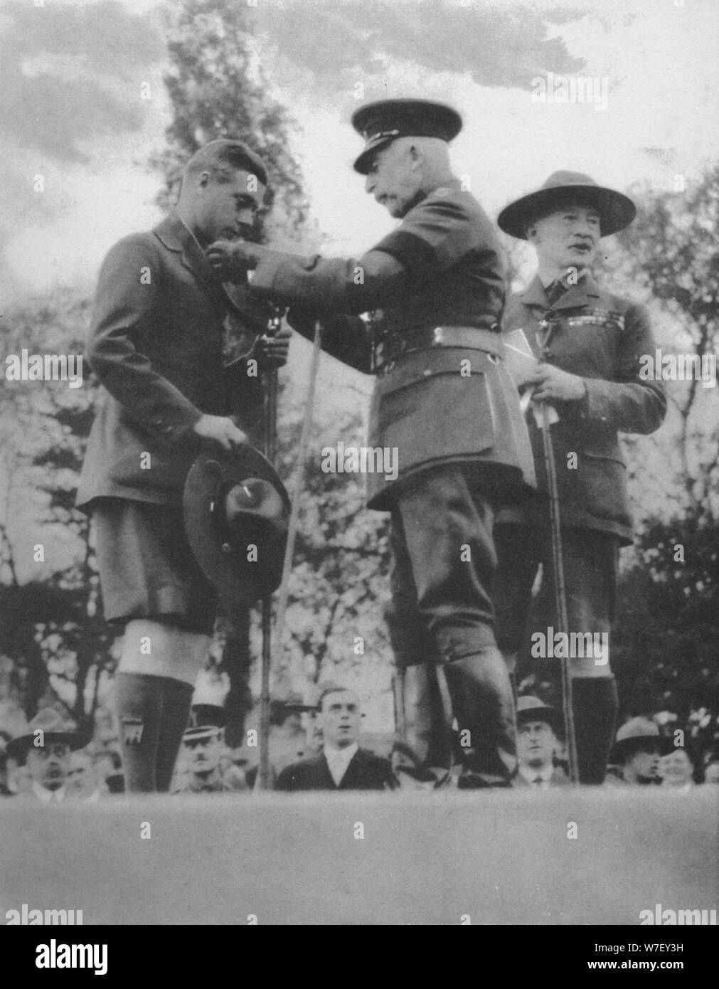 The Prince of Wales being invested with the Silver Wolf by the Duke of Connaught, 1922 (1936). Artist: Unknown. Stock Photo