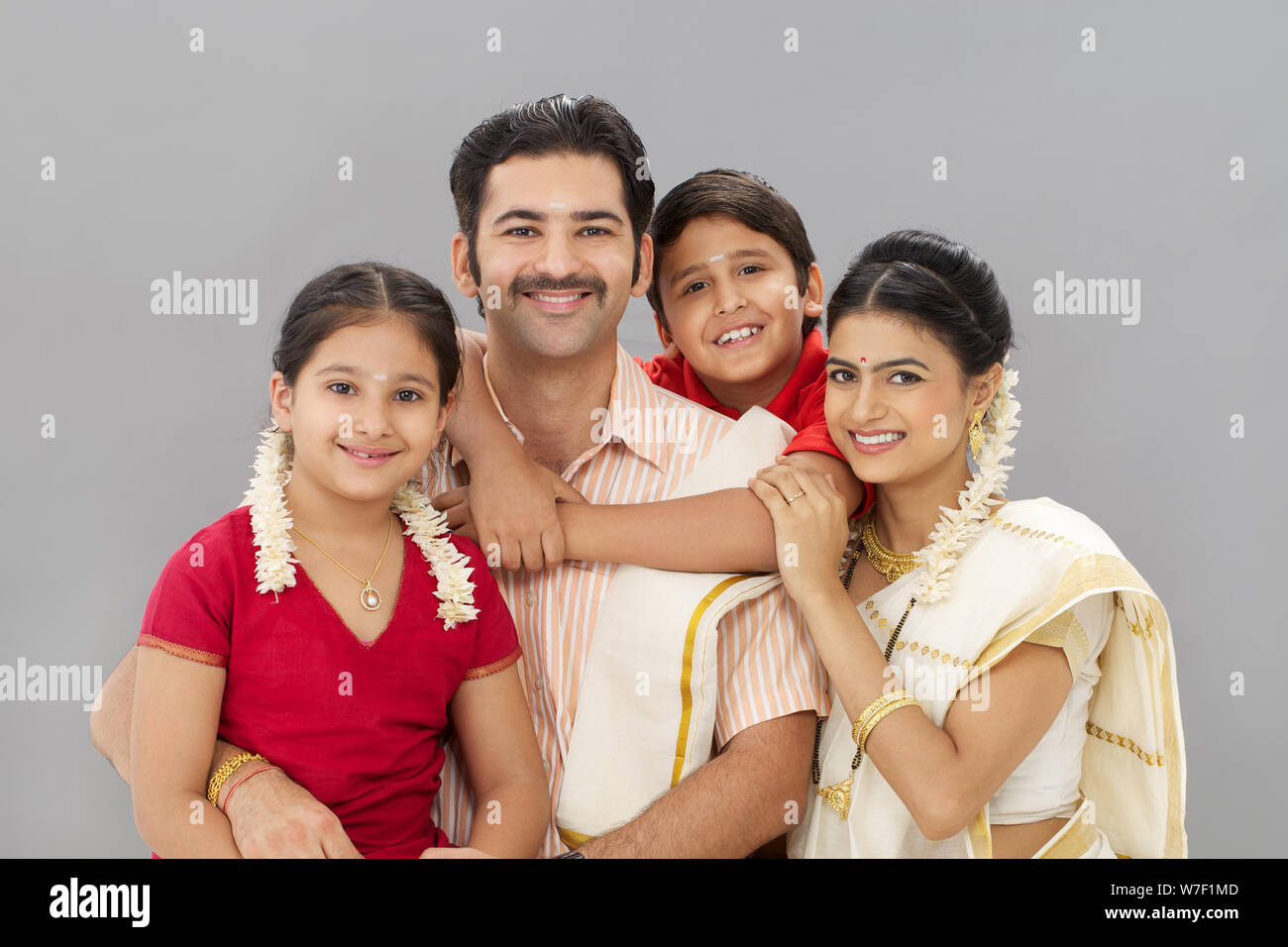 Portrait of a South Indian family smiling Stock Photo