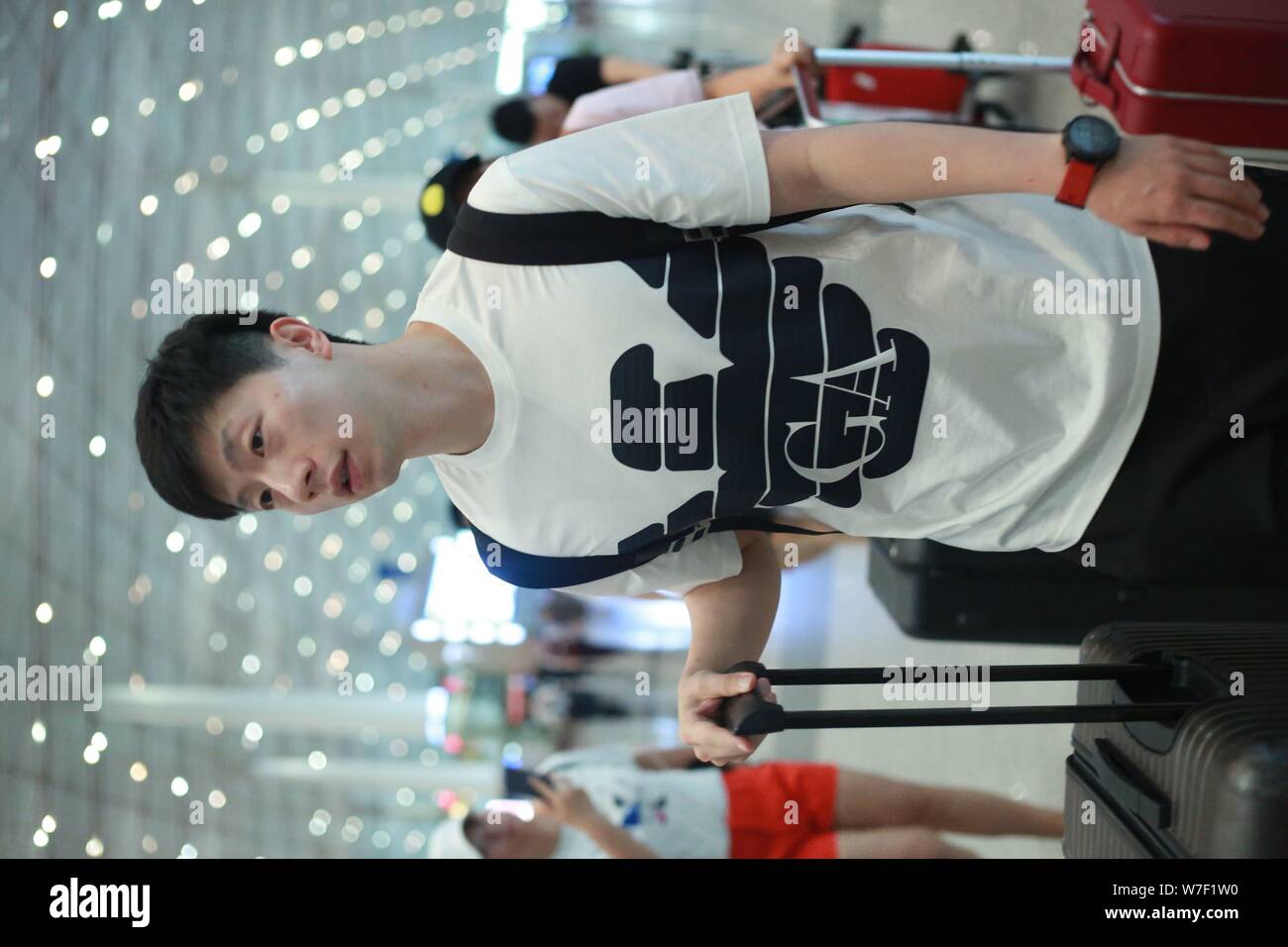 Ma Long, a member of China national table tennis team, shows up at Beijing Capital International Airport before departure to Los Angeles for closed training in Beijing, China, 5 August 2019. Stock Photo