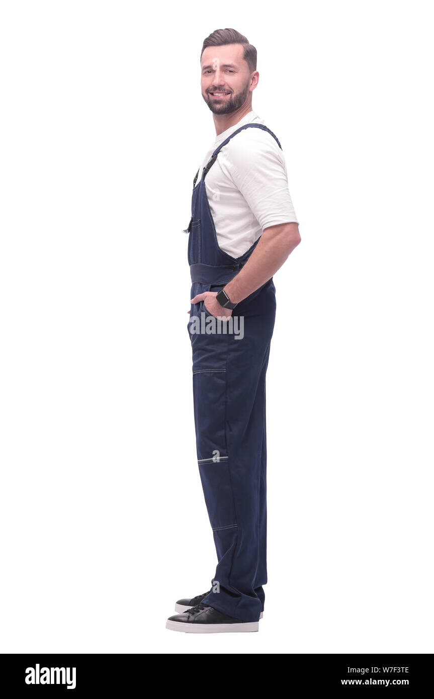 side view. smiling man in blue overalls. isolated on white Stock Photo