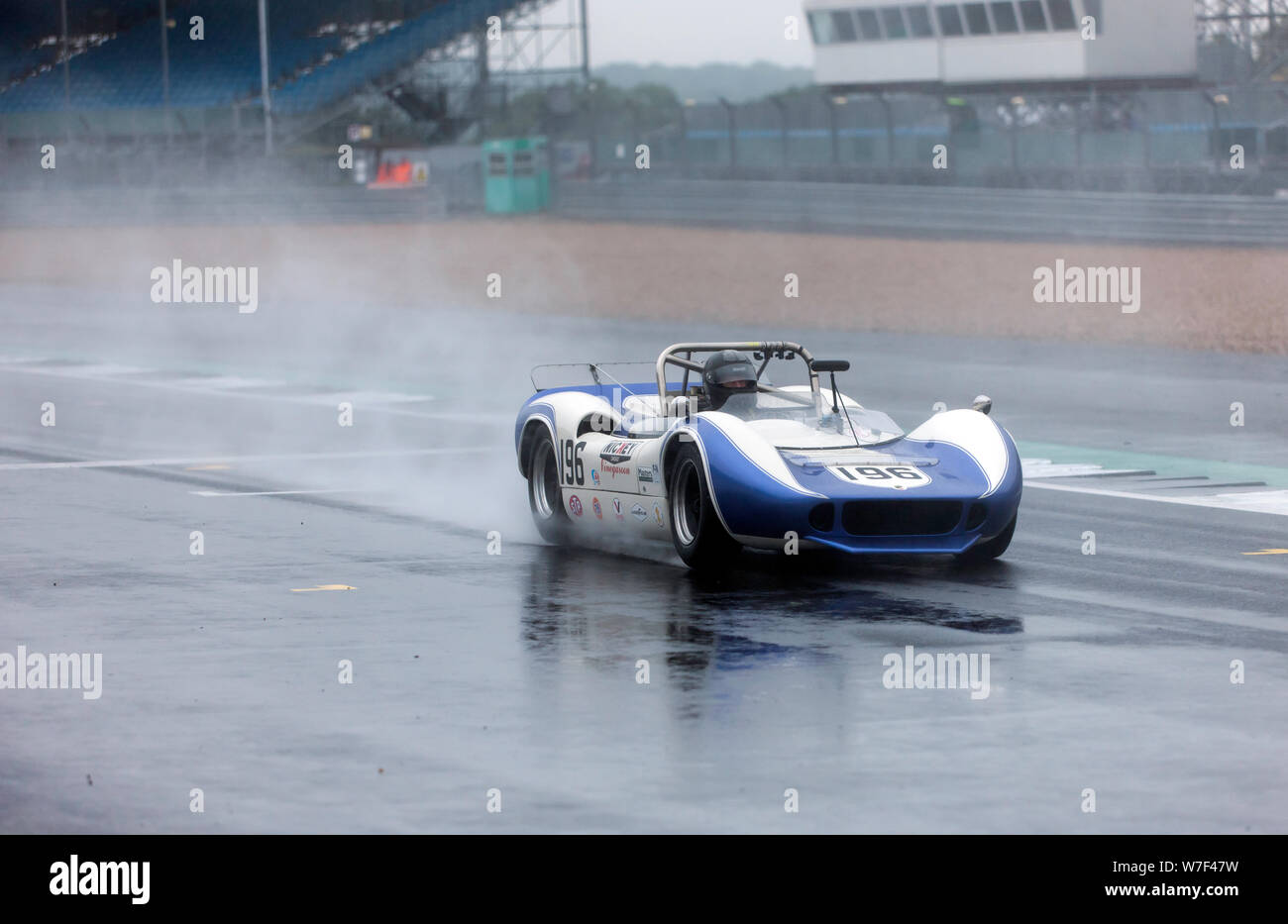 John Spiers driving his 1966, McLaren Elva M1B, in the wet, during the HSCC Thundersports Race at the 2019 Silverstone Classic Stock Photo