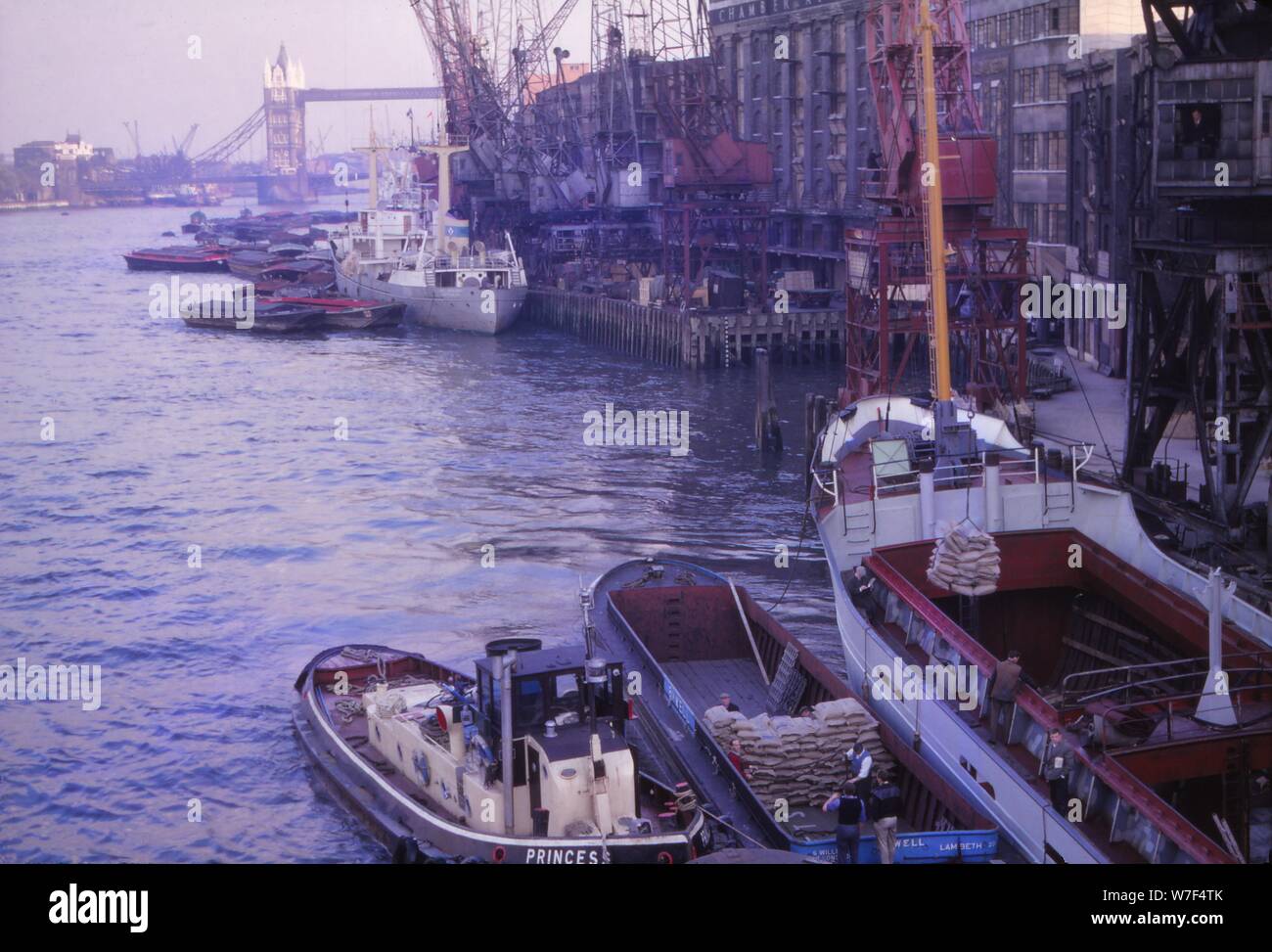 Barges in the Pool of London. River Thames and Tower Bridge, London, 1962. Artist: CM Dixon. Stock Photo