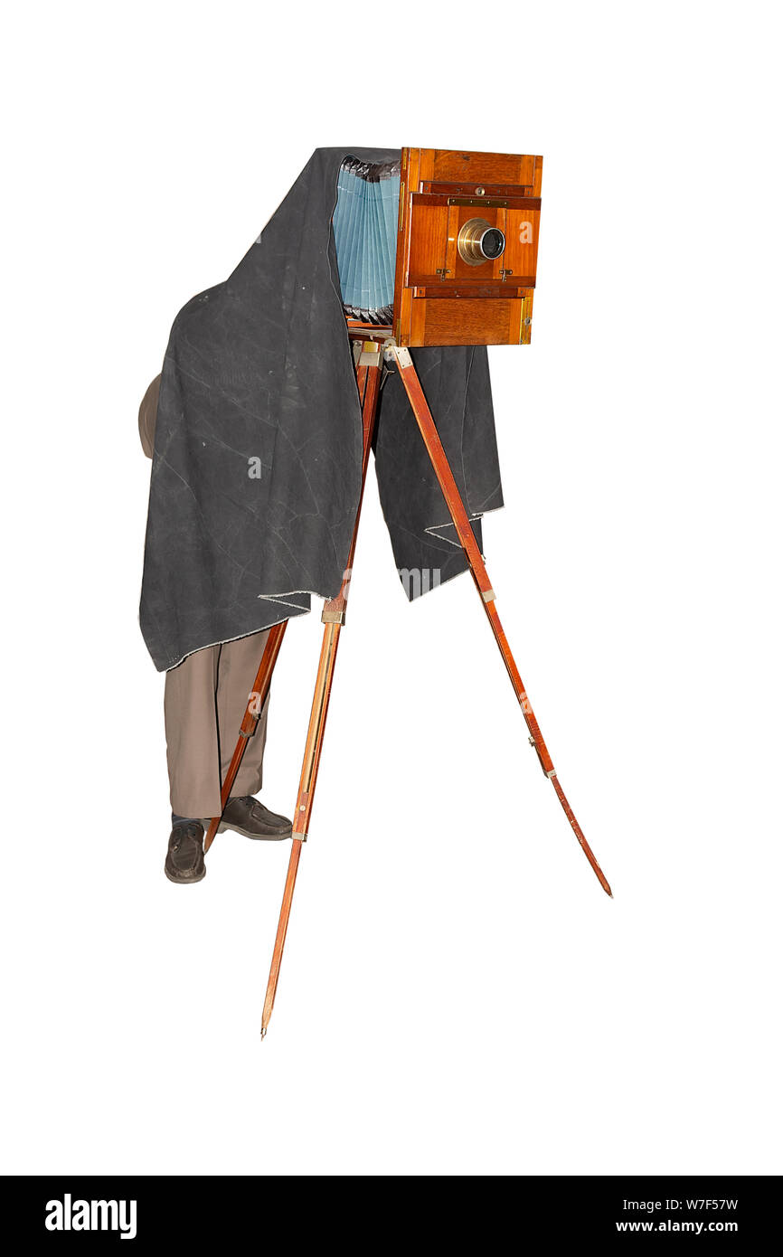 Photographer taking picture with vintage foto camera. Ancient wooden ...
