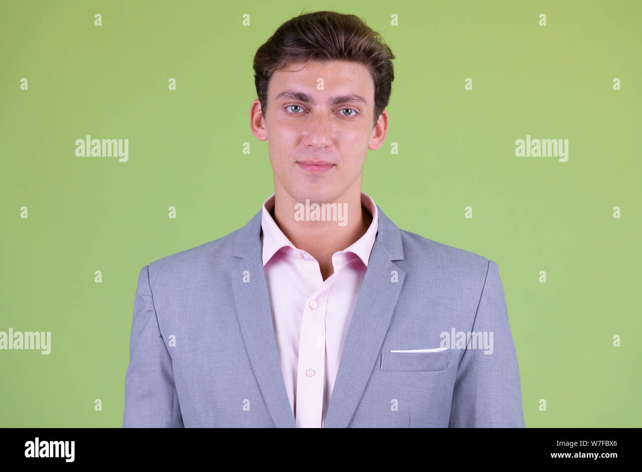 Face of young handsome businessman wearing suit Stock Photo - Alamy