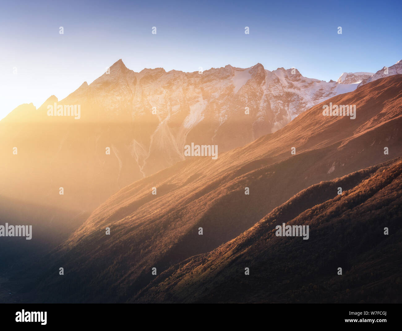 Beautiful mountains with snowy peaks at sunny morning in Nepal Stock Photo