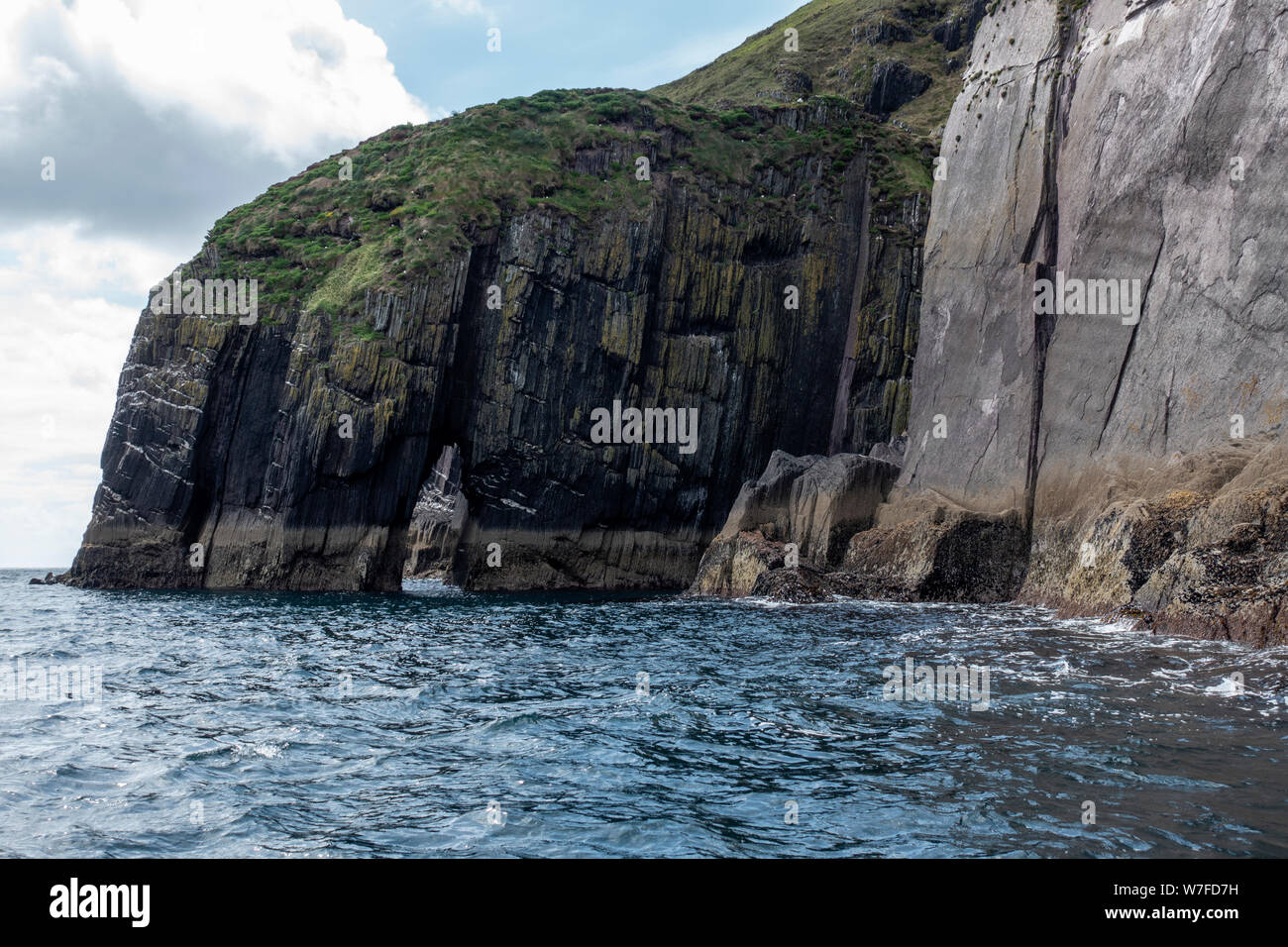 Sea arch viewed from boat - Dingle Peninsula, County Kerry, Republic of Ireland Stock Photo