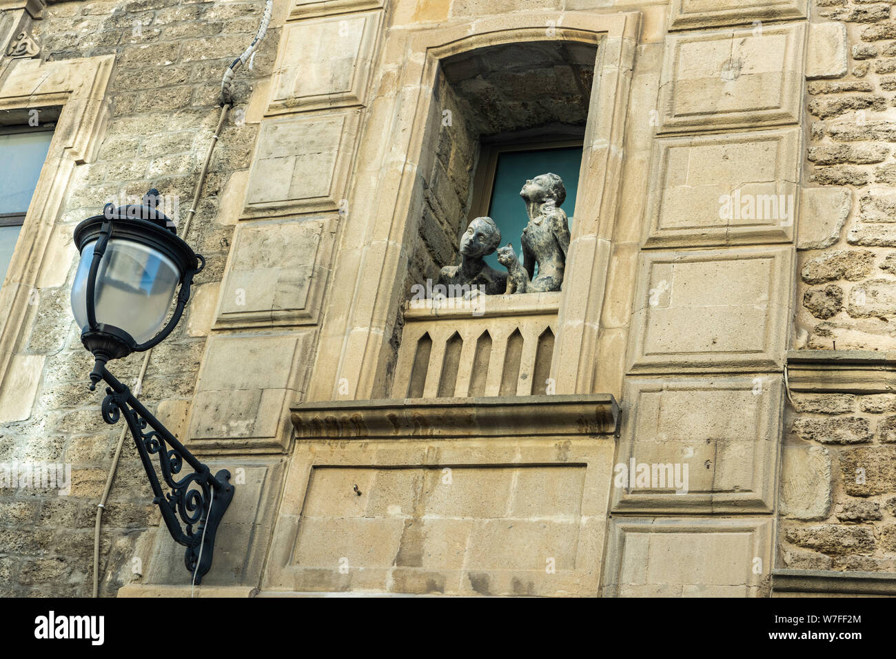 Baku Azerbaijan April 26 19 Sculpture Of A Girl A Boy And A Cat Looking Out Of A Window On Basheni Street In Old Town Quarter Of Baku Stock Photo Alamy