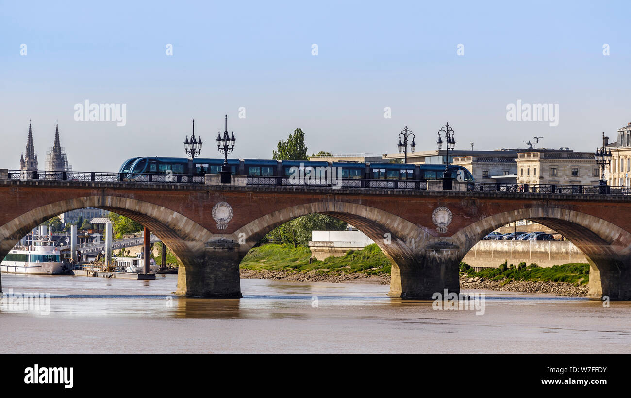 Approaching the 1822 Pont de Pierre, or Stone Bridge, Bordeaux. Known for 17 arches, the same number as letters in Napoleon Bonaparte. Tramway route. Stock Photo