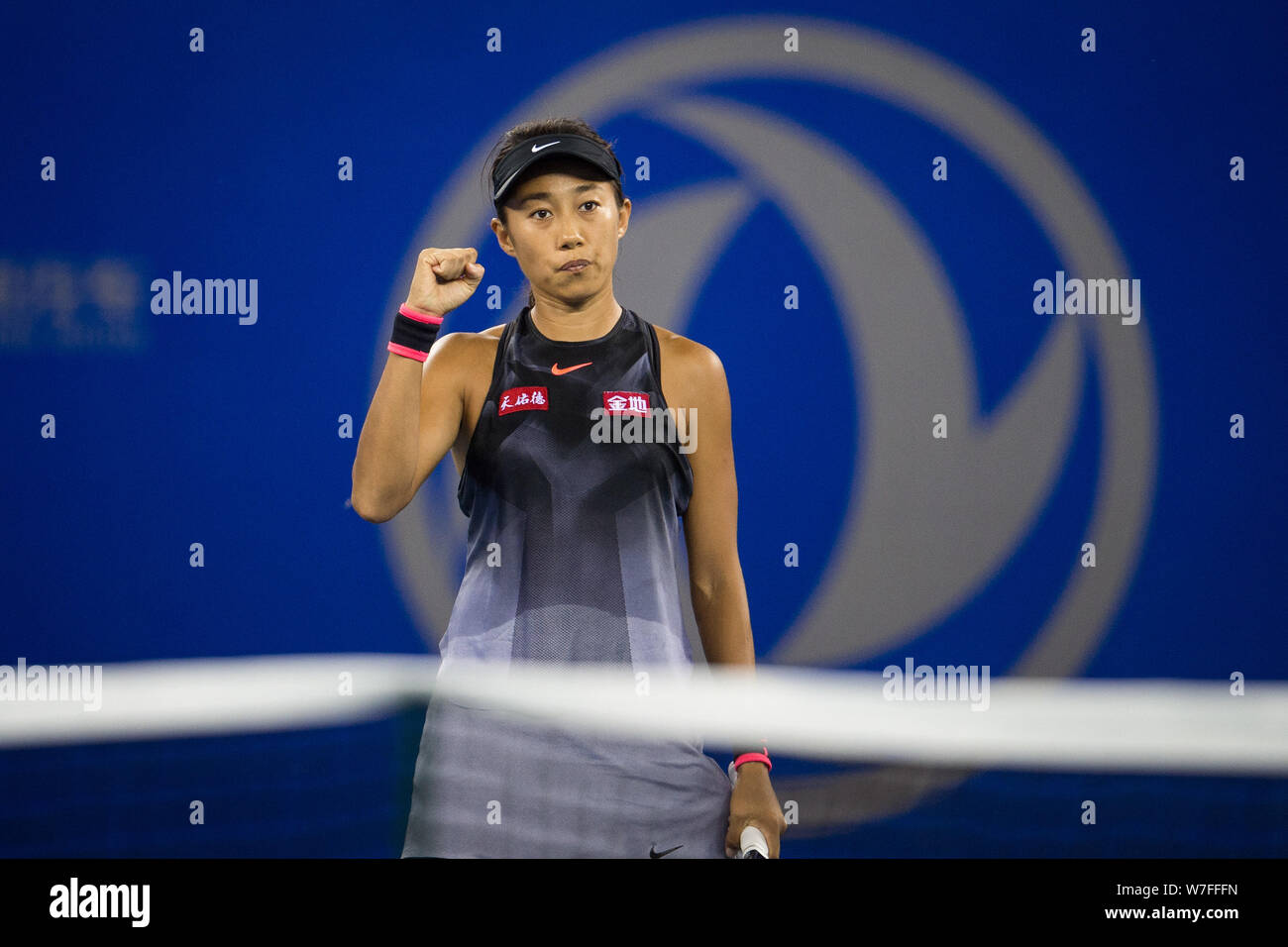 Zhang Shuai of China reacts after scoring against Donna Vekic of