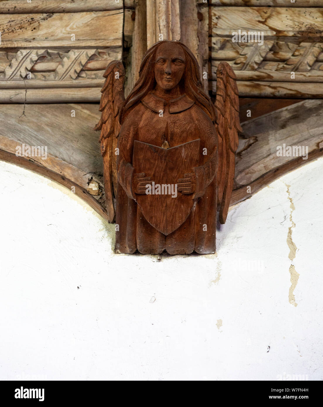 Church of All Saints, Great Glemham, Suffolk, England, UK carved wooden angel roof beam Stock Photo