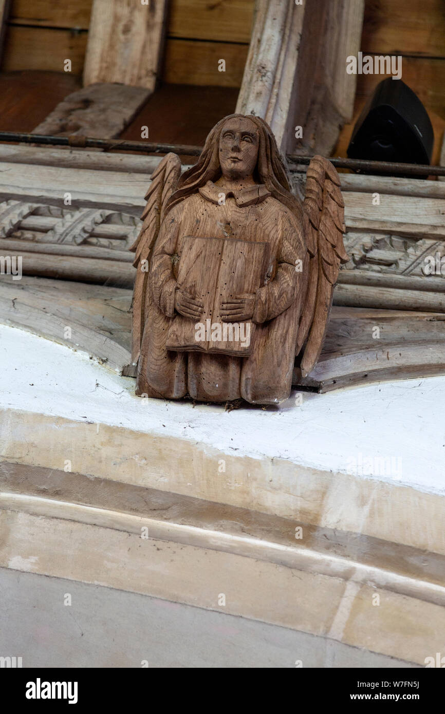 Church of All Saints, Great Glemham, Suffolk, England, UK carved wooden angel roof beam Stock Photo