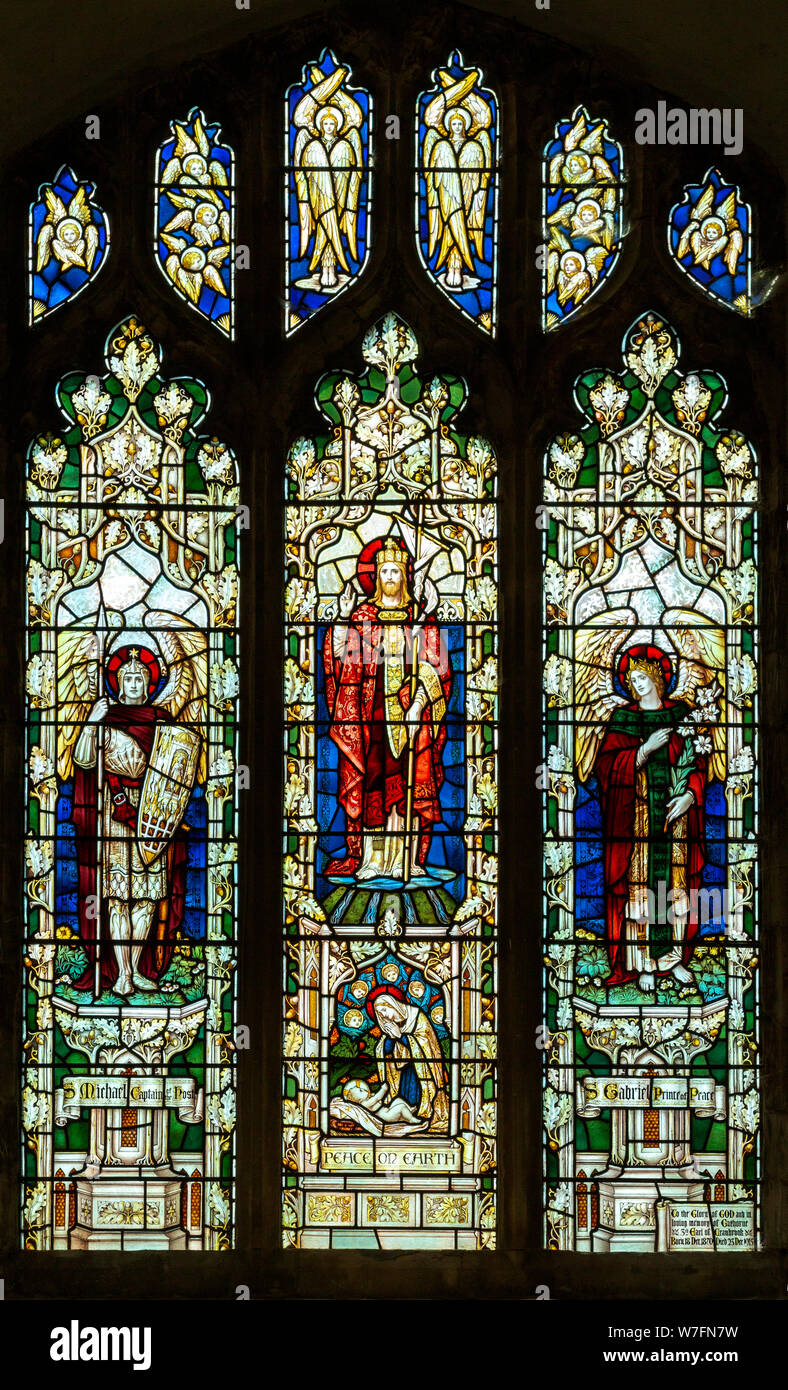 Great Glemham church, Suffolk, stained glass window east window Risen Christ flanked by St Michael and St Gabriel by Powell & Son c 1915 Stock Photo