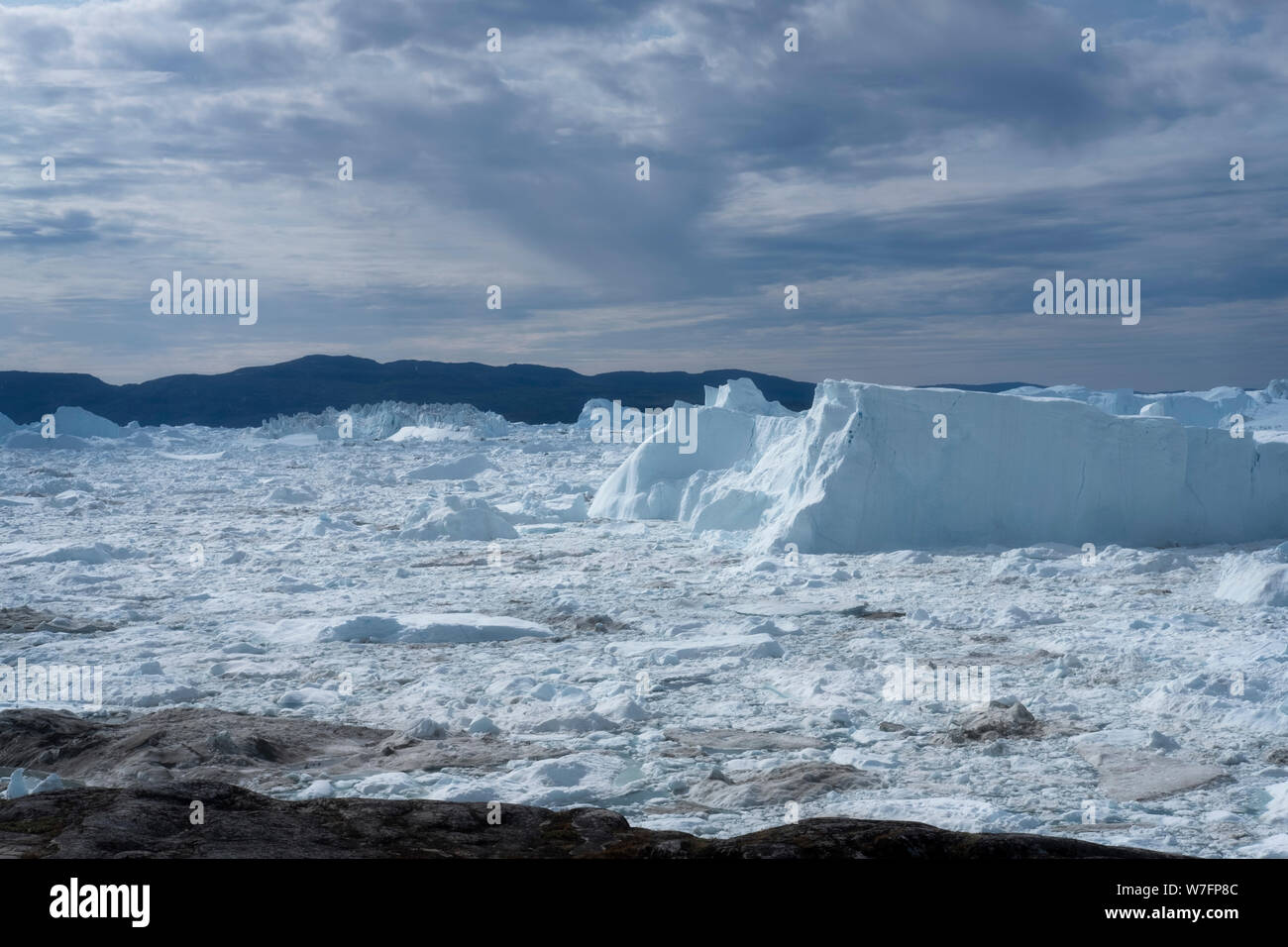 Huge icebergs in the Ilulissat ice fjord, a Unesco world heritage site, near Ilulissat in western Greenland. Stock Photo
