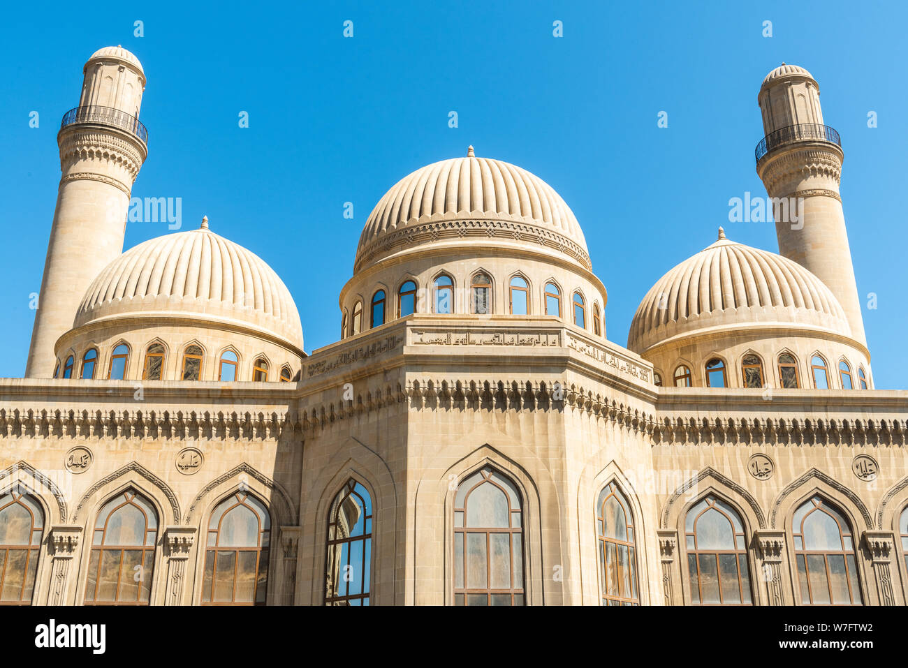Bibi-Heybat, Baku, Azerbaijan - May 11, 2019.  Minarets and domes of the Bibi-Heybat mosque in Baku. The existing structure, built in the 1990s, is a Stock Photo