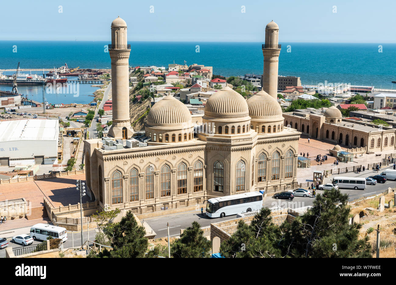 Bibi-Heybat, Baku, Azerbaijan - May 12, 2019. View over Bibi-Heybat mosque in Baku, with shipyard facilities, Caspian Sea and Bibi-Heybat settlement i Stock Photo