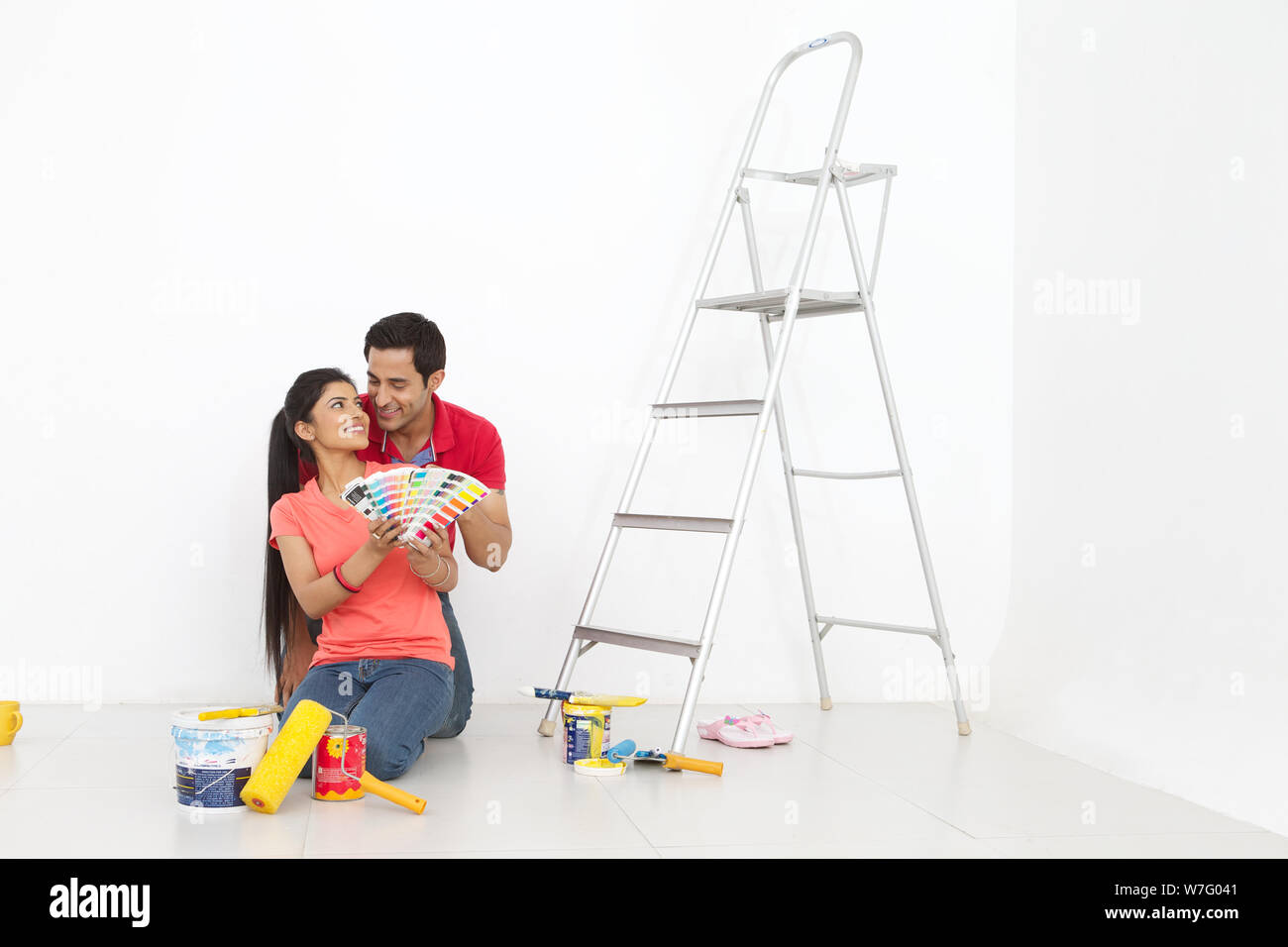 Young couple choosing colours from colour sample Stock Photo - Alamy