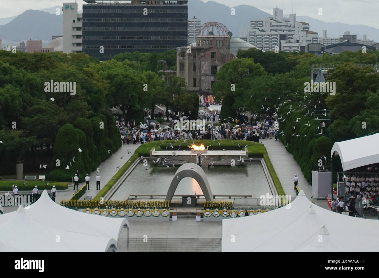Hiroshima, Japan. 6th Aug, 2019. People attend an annual memorial ceremony in Hiroshima, Japan, Aug. 6, 2019. Hiroshima, a Japanese city hit by a U.S. atomic bomb at the end of World War II, marked the 74th anniversary of the bombing on Tuesday. Credit: Peng Chun/Xinhua/Alamy Live News Stock Photo