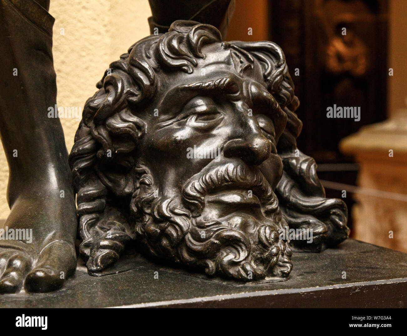 David legs with the Head of Goliath statue Stock Photo Alamy