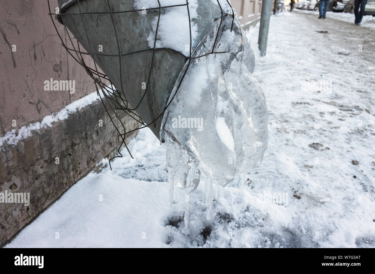 Frozen urban downspout with ice. Winter in Saint-Petersburg, Russia Stock Photo