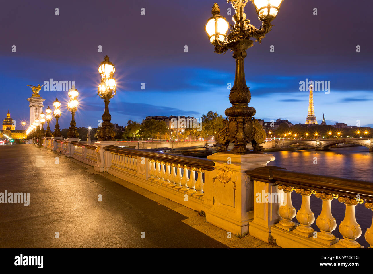 Twilight along Pont Alexandre III over River Seine, Paris, France Stock Photo