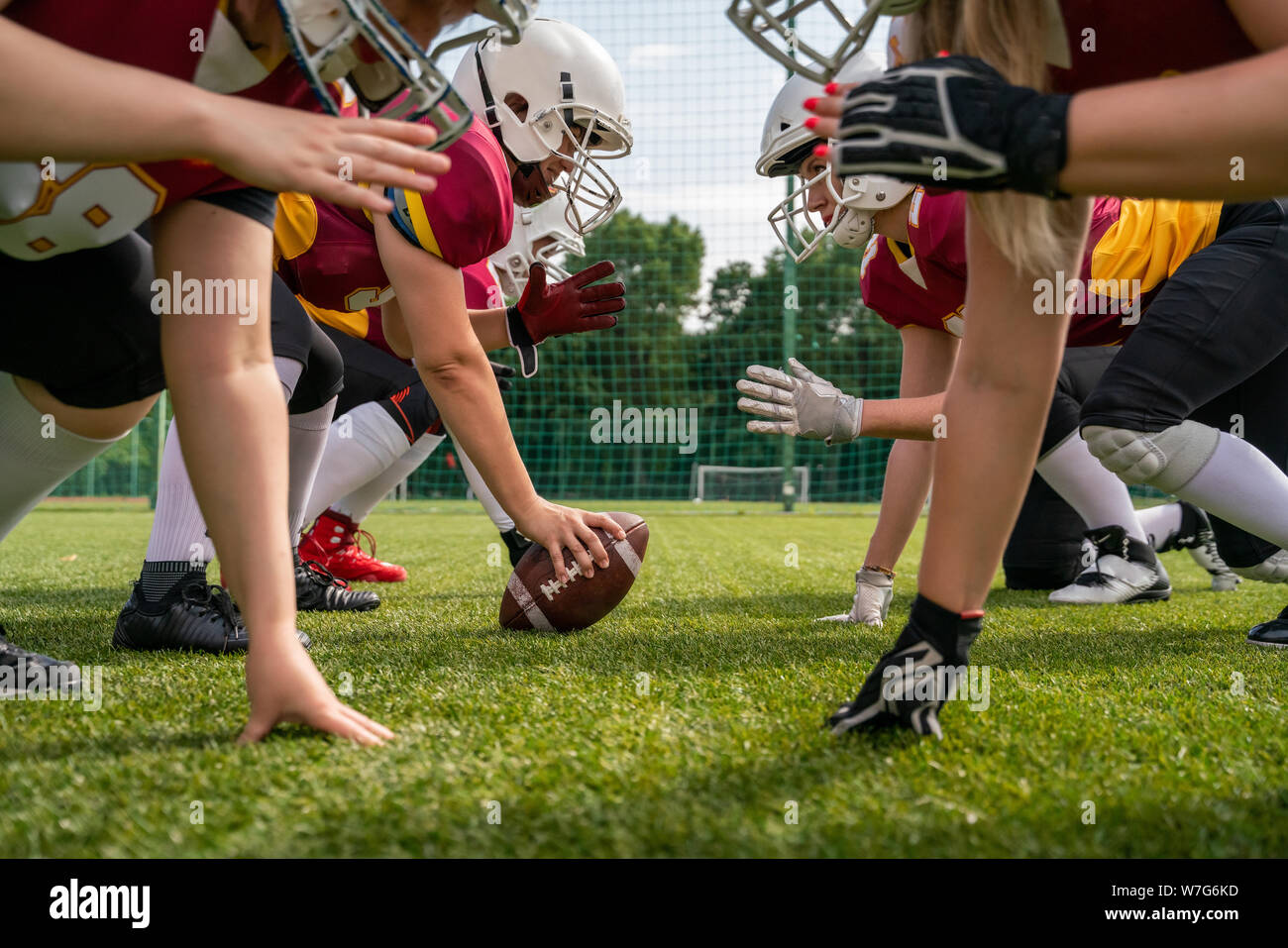 Photo of athletes women playing american football on sports field Stock Photo