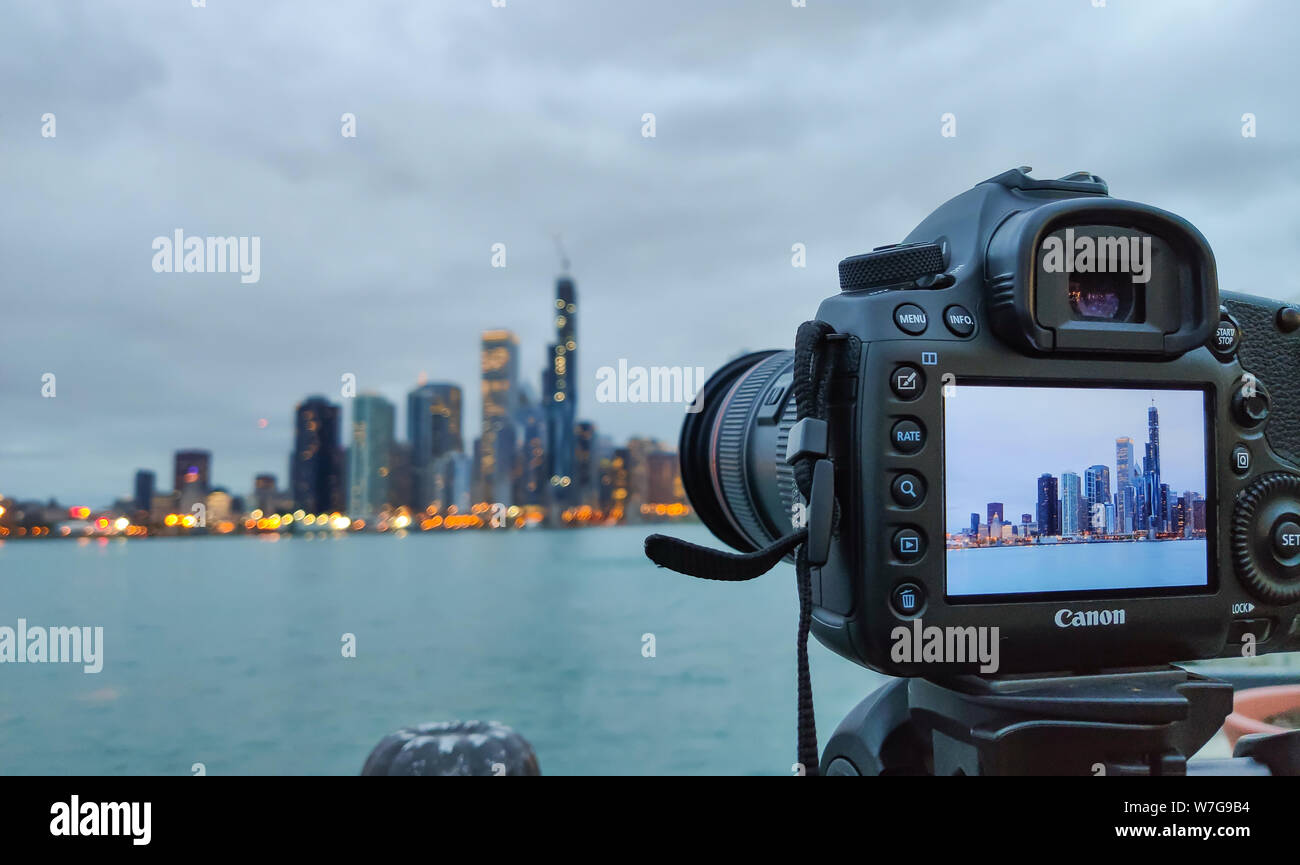 Chicago, Illinois USA. May 9, 2019.  Skyline in camera display. Skyscrapers illumunated under blue american cloudy sky blur background. Business and t Stock Photo