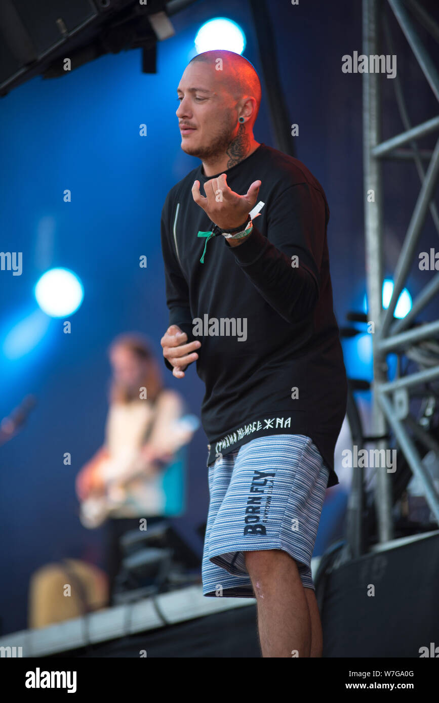BONTIDA, ROMANIA - JULY 19, 2019: Sign language interpreter translating a song for persons with hearing impediment at Electric Castle festival Stock Photo