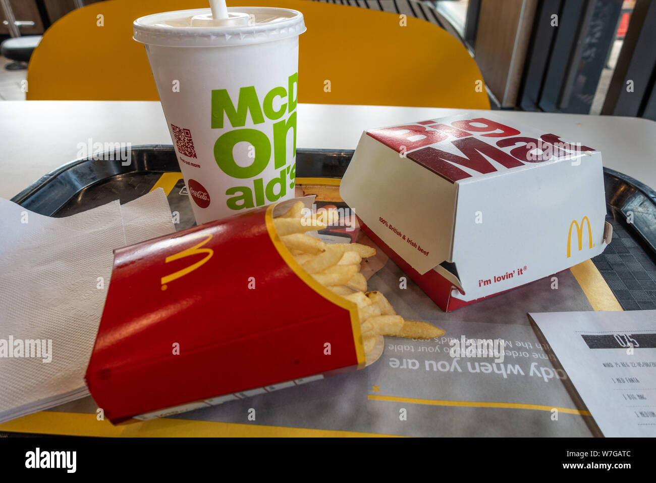 A Big Mac Meal on a table in a McDonalds Fast Food restaurant. Stock Photo