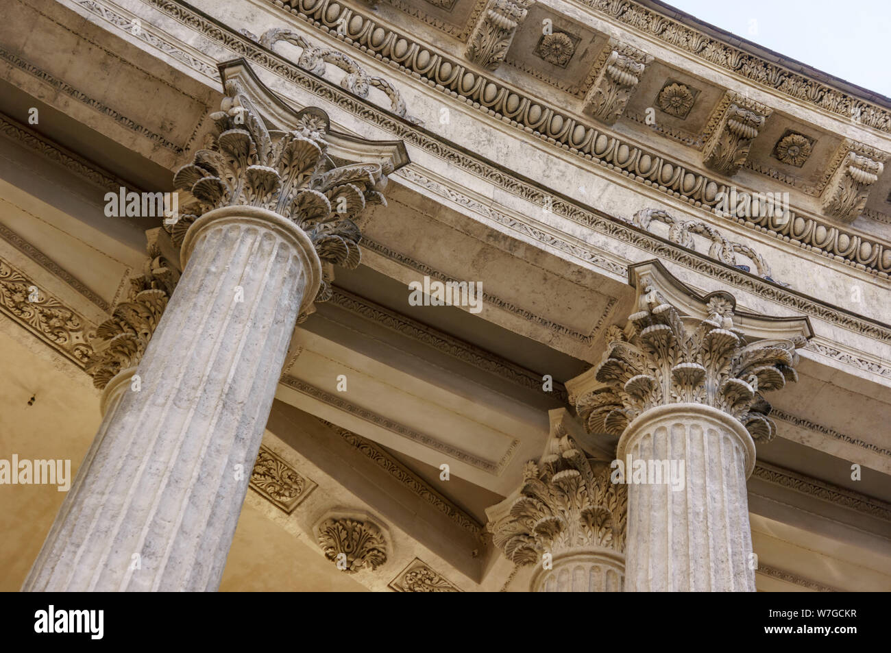 Vintage Old Justice Courthouse Column. Stone column ancient classic architecture detail. Abstract view of neoclassical fluted columns bases and steps Stock Photo