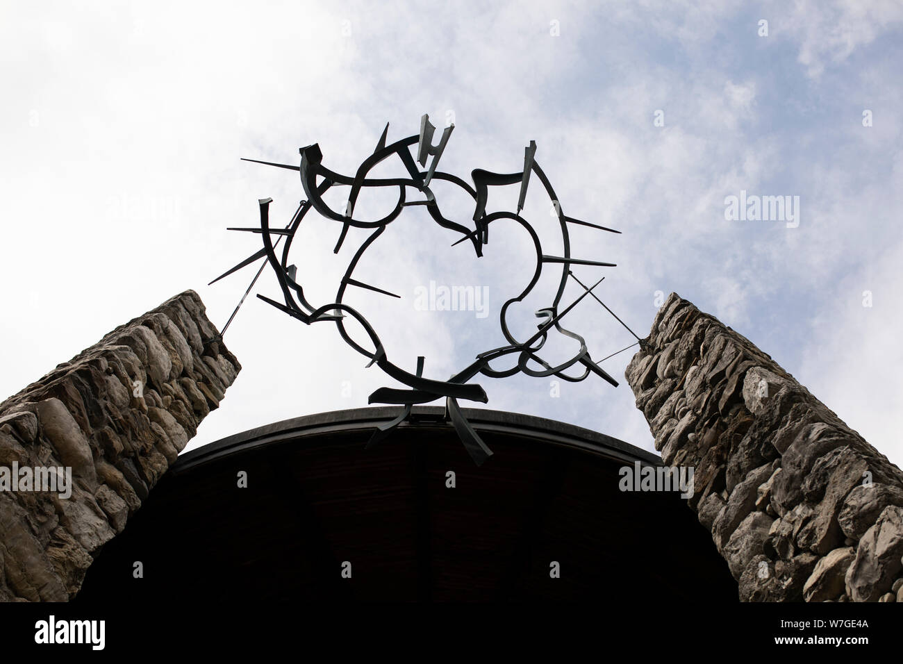 A crown of thorns sculpture atop of the Mortal Agony of Christ Chapel, the Catholic memorial site at the former concentration camp in Dachau, Germany. Stock Photo