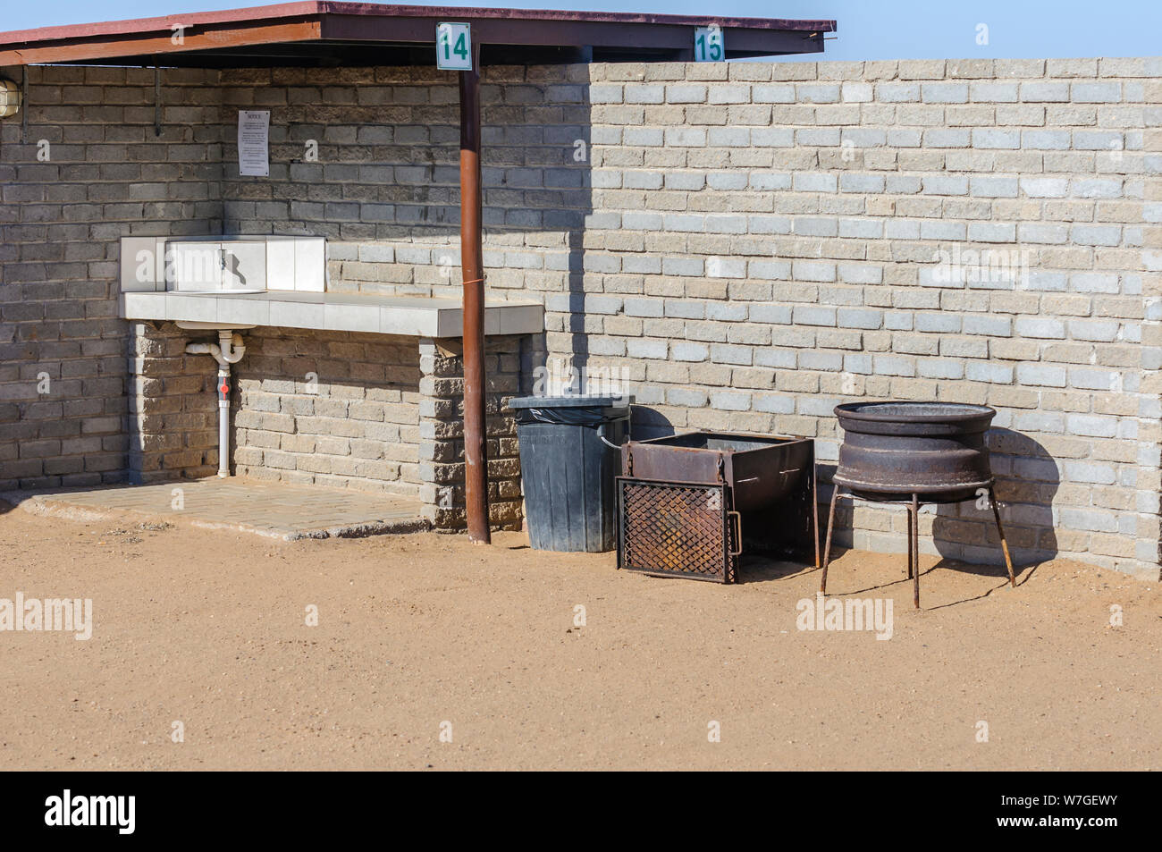 Facilities, including a sink, bin, bench and barbeque at a campsite in Namibia Stock Photo
