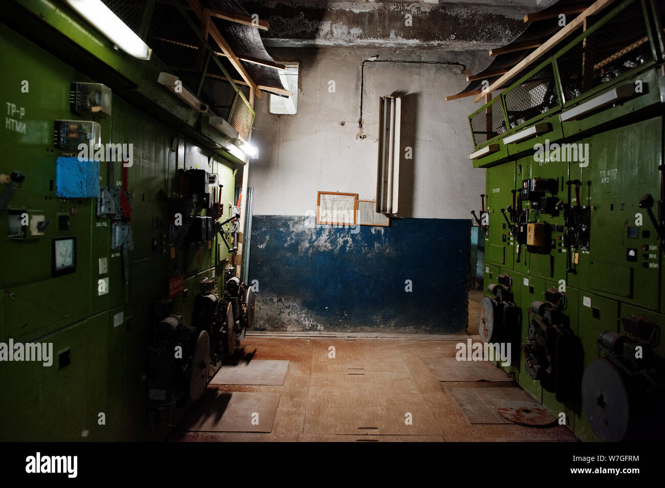 Industrial interior of an old abandoned factory.  Eectrical shield switchboard with high voltage. Stock Photo